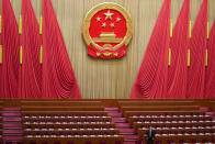 An official prepares prior to the second plenary session meeting of the National People's Congress (NPC) in the Great Hall of the People in Beijing, China, Friday, March 8, 2024. (AP Photo/Tatan Syuflana).