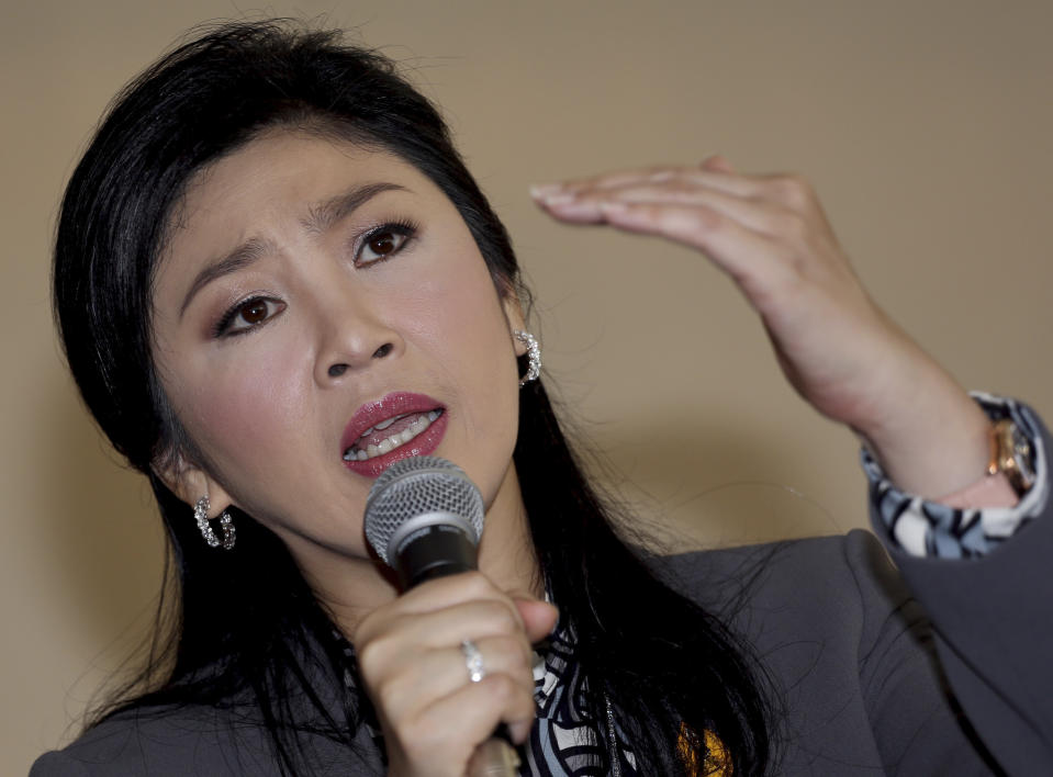 FILE - In this Jan. 17, 2014 file photo, Thai Prime Minister Yingluck Shinawatra gestures as she answers questions during an interview with the foreign media at the office of Permanent Secretary for Defense on the outskirts of Bangkok, Thailand. From inside her “war room” in a temporary office at the Defense Ministry, Yingluck is watching television feeds of flag-waving protesters trying to bring down her government. The demonstrators have taken over key pockets of downtown Bangkok, blocking off their territory with sandbag walls guarded by supporters. They refuse to negotiate, and they’re trampling campaign billboards bearing her image amid increasing doubt that the election she called next month can be held. Yingluck can’t order a police crackdown for fear of triggering a military coup. And she is now facing a serious legal threat: the country’s anti-corruption commission announced this week it will probe her handling of a controversial rice policy, an investigation that could force her from office if it is successful. (AP Photo/Apichart Weerawong, File)