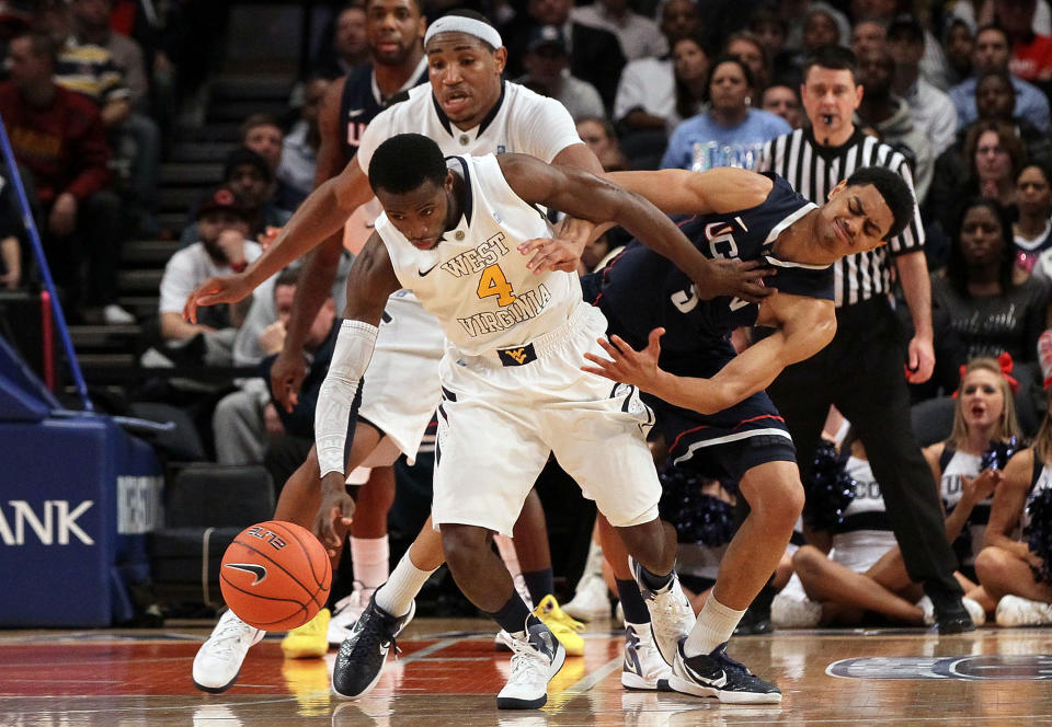 NEW YORK, NY - MARCH 07: Jabarie Hinds #4 of the West Virginia Mountaineers steals the ball from Jeremy Lamb #3 of the Connecticut Huskies during their second round game of the 2012 Big East Men's Basketball Tournament at Madison Square Garden on March 7, 2012 in New York City. (Photo by Jim McIsaac/Getty Images)