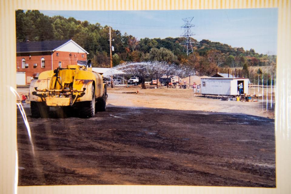 Photos like this of the construction of the Claxton playground in 2000 are collected in a photo album kept at the Claxton Community Center.