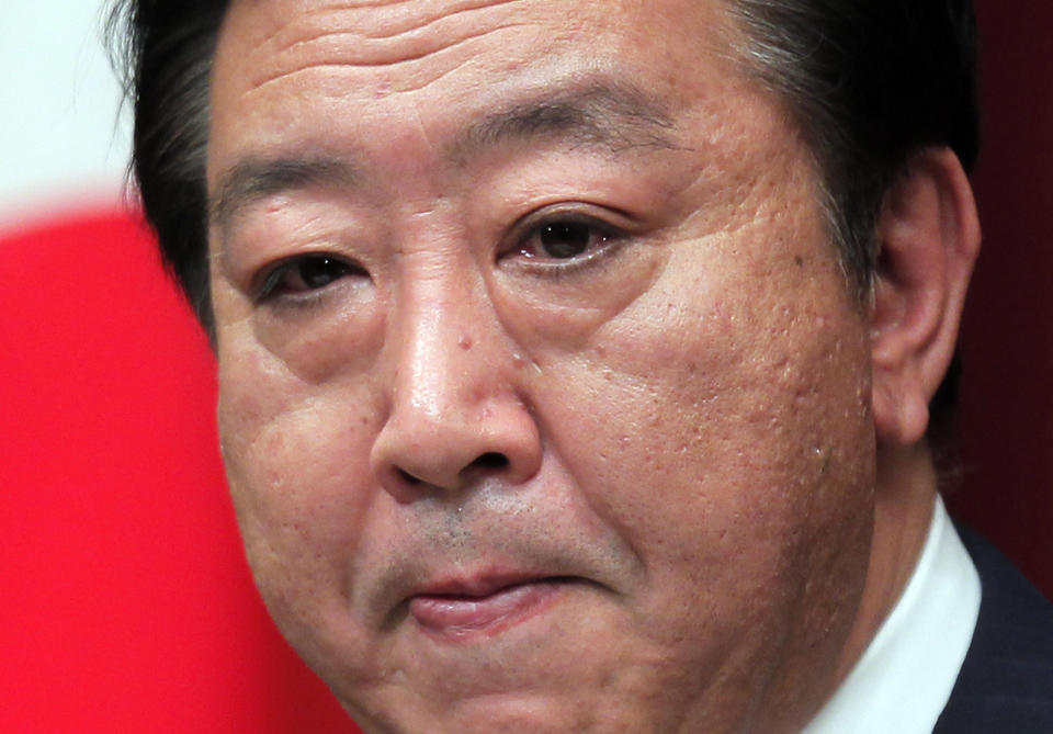 Japanese Prime Minister Yoshihiko Noda reacts during a televised news conference at the Prime Minister's official residence in Tokyo Friday, June 8, 2012. Noda appealed to the nation to accept that two nuclear reactors that remained shuttered after the Fukushima disaster must be restarted to protect the economy and people's livelihoods. (AP Photo/Itsuo Inouye)
