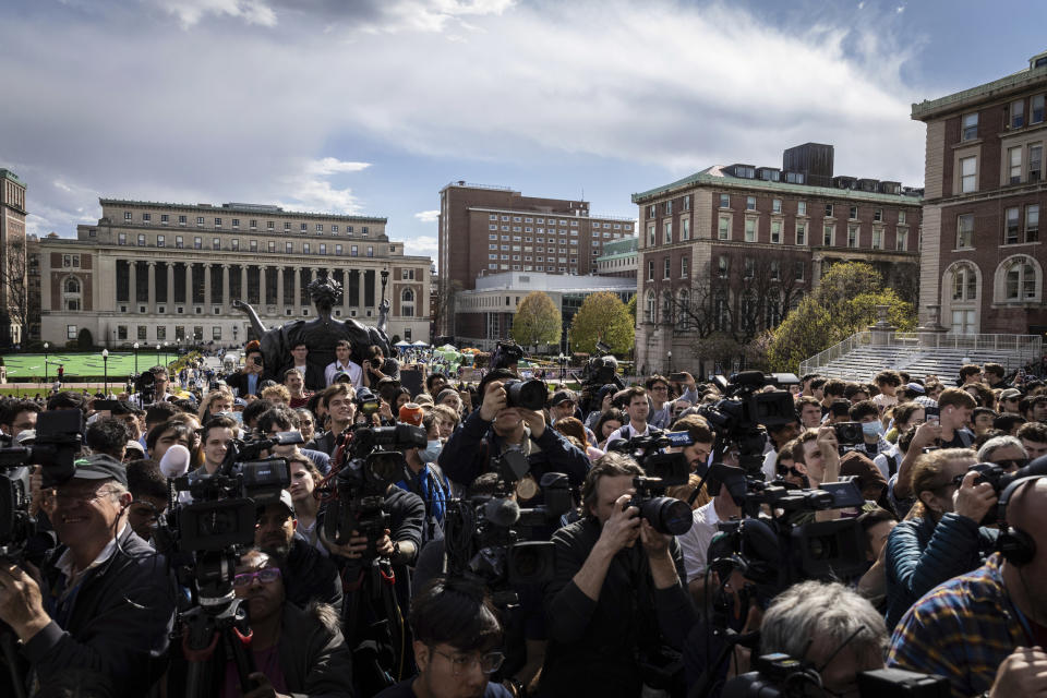 Students and press look on as Speaker of the House Mike Johnson, R-La., speaks to the media on the Lower Library steps on Columbia University's campus in New York, on Wednesday, April 24, 2024. (AP Photo/Stefan Jeremiah)