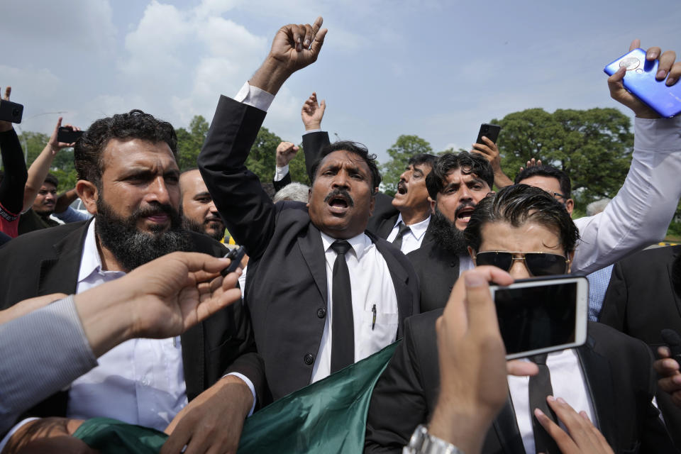 Lawyers chant slogans in favor of the country's imprisoned former Prime Minister Khan at outside the Islamabad High Court in Islamabad, Pakistan, Thursday, Aug. 24, 2023. A court in Pakistan's capital is likely to issue a crucial ruling Thursday on an appeal from the country's imprisoned former Prime Minister Khan against his recent conviction and three-year sentence in a graft case, one of his lawyers said. (AP Photo/Anjum Naveed)