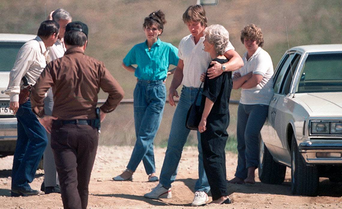 April 16, 1987: Wrestler Mike Von Erich’s body was discovered near Lake Lewisville after being reported missing by his family. Kevin Von Erich holds his mother, Doris Adkisson. At right is brother Chris Von Erich. [FWST photographer Ron Jenkins] Ron Jenkins/Fort Worth Star-Telegram/UT Arlington Special Collections