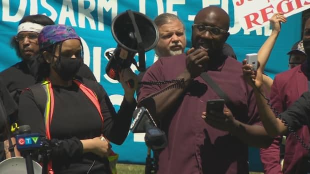 The protesters gathered on the grounds of Queen's Park for a memorial in honour of Regis Korchinski-Paquet, 29, who died on May 27, 2020. (Martin Trainor/CBC - image credit)