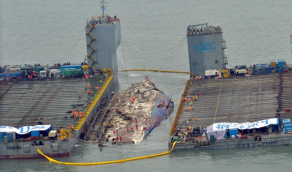 In this handout photo released by Hankook Daily, a submersible vessel attempts to salvage sunken Sewol ferry in waters off Jindo, on March 22, 2017, in Jindo-gun, South Korea. The South Korean government attempted to raise the Sewol ferry on March 22, 2017. The Sewol sank off the Jindo Island in April 2014. (Photo by Hankook Daily via Getty Images)