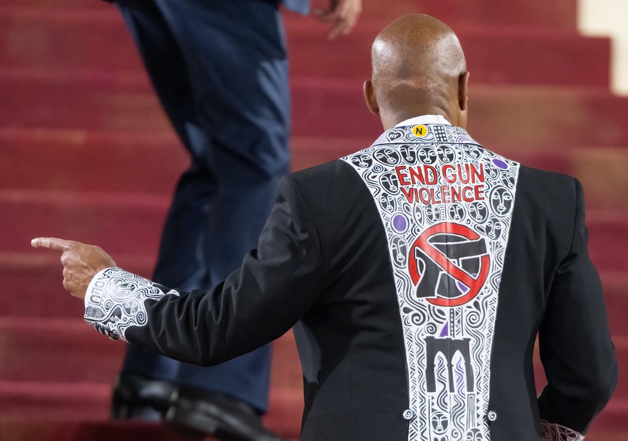 Eric Adams at the Met Gala wearing a jacket reading End Gun Violence