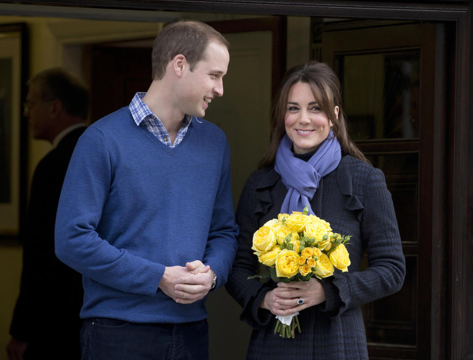 FILE - In this Thursday, Dec. 6, 2012 file photo Britain's Prince William stands next to his wife Kate, Duchess of Cambridge as she leaves the King Edward VII hospital in central London. Prince William's wife Kate has been admitted to the hospital in early stages of labor it was announced on Monday July 22, 2013. (AP Photo/Alastair Grant, File)