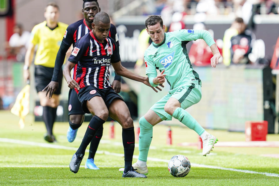 Hoffenheim's Sebastian Rudy, right, und Frankfurt's Gelson Fernandes fight for the ball during German Bundesliga soccer match between Eintracht Frankfurt and TSG 1899 Hoffenheim in Frankfurt, Germany, Sunday, Aug.18, 2019. (Uwe Anspach/dpa via AP)