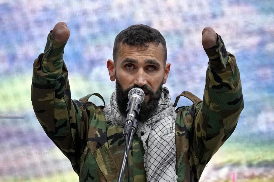 A wounded Hezbollah fighter sings a religious chant before a speech by Hezbollah leader Sayyed Hassan Nasrallah via a video link, during a rally to mark the "Wounded Resistance Day," in the southern Beirut suburb of Dahiyeh, Lebanon, Monday, March 6, 2023. The leader of Lebanon’s militant Hezbollah group said Monday that they back former Cabinet minister and strong ally Sleiman Frangieh to become Lebanon’s next president. (AP Photo/Bilal Hussein)