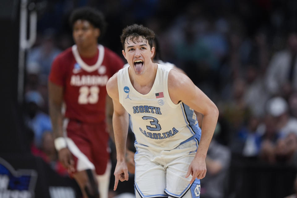 North Carolina guard Cormac Ryan (3) celebrates after scoring during the first half of a Sweet 16 college basketball game against Alabama in the NCAA tournament Thursday, March 28, 2024, in Los Angeles. (AP Photo/Ryan Sun)