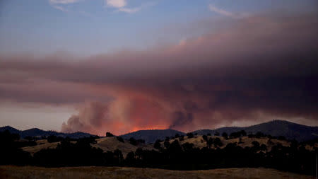 Smoke rises as the large fire spread along Pope Valley in California, U.S., September 8, 2018 in this picture obtained on September 8, 2018 from social media. Craig Philpott/via REUTERS