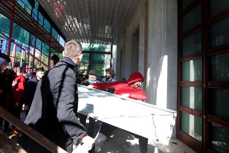 Supporters of the opposition party try to break into a government building that houses the office of Prime Minister Edi Rama during an anti-government protest in Tirana, Albania, February 16, 2019. REUTERS/Florion Goga