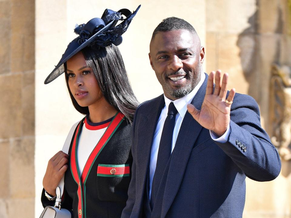 Sabrina Dhowre and Idris Elba attend the wedding of Prince Harry to Ms Meghan Markle at St George's Chapel, Windsor Castle.