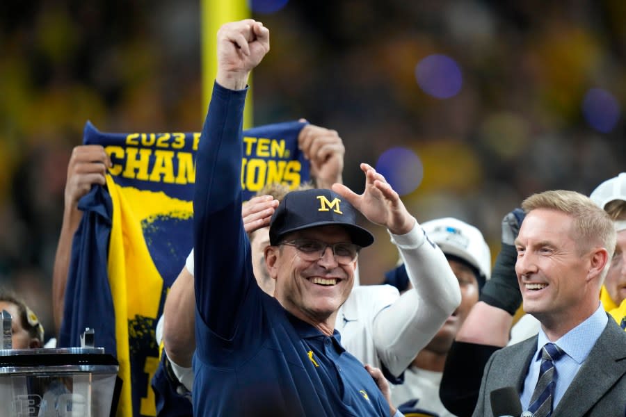 Michigan head coach Jim Harbaugh celebrates after the Big Ten championship NCAA college football game against Iowa, Saturday, Dec. 2, 2023, in Indianapolis. Michigan won 26-0. (AP Photo/AJ Mast)