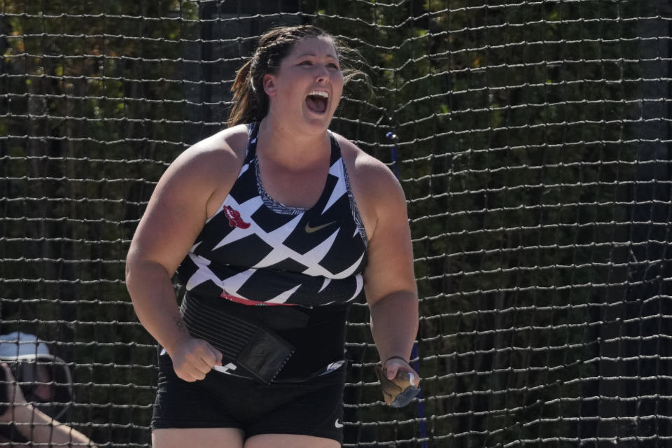 DeAnna Price reacts after setting a new American record during the finals of the women's hammer throw at the U.S. Olympic Track and Field Trials Saturday, June 26, 2021, in Eugene, Ore. (AP Photo/Ashley Landis)