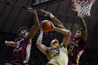 Purdue forward Caleb Furst (3) is fouled as he shoots between Florida State guards Anthony Polite (2) and Cam'Ron Fletcher (21) during the second half of an NCAA college basketball game in West Lafayette, Ind., Tuesday, Nov. 30, 2021. Purdue defeated Florida State 93-65. (AP Photo/Michael Conroy)