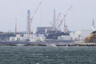 Fukushima Daiichi nuclear power plant is seen from Namie town, Fukushima prefecture, north of Tokyo, Tuesday, April 13, 2021, Japan's government said Tuesday it has decided to start releasing massive amounts of radioactive water stored in tanks at the wrecked Fukushima nuclear plant in two years after treatment. (Yusuke Ogata/Kyodo News via AP)