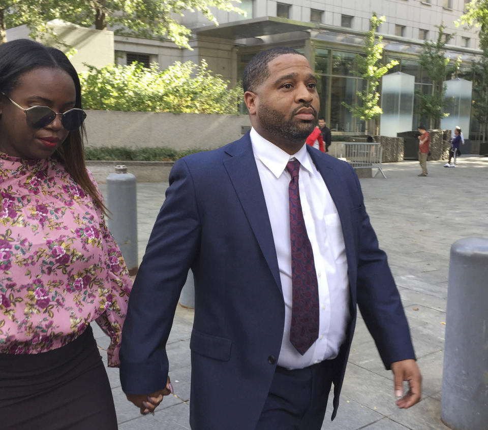 FILE - In this Oct. 10, 2017, file photo, University of Arizona assistant men's basketball coach Emanuel Richardson leaves Manhattan federal court in New York. Richardson, no longer with the team, is expected in federal court, Tuesday, Jan. 22, 2019, for a development in a criminal case in which he is charged with taking bribes from a sports agent. (AP Photo/Larry Neumeister, File)