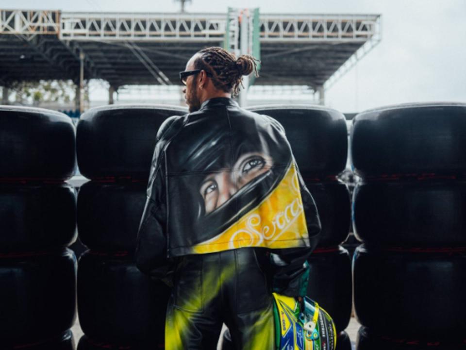 Lewis Hamilton wearing a Senna-inspired jacket in Interlagos last year (Twitter - @LewisHamilton)