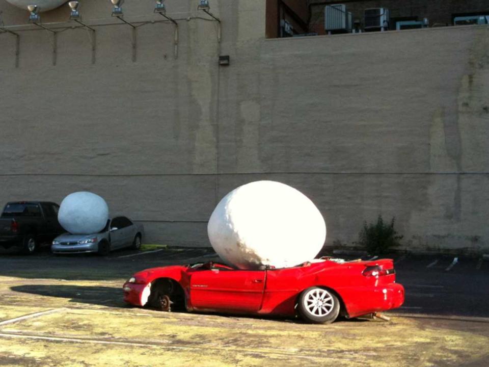 red car crushed snowball hail