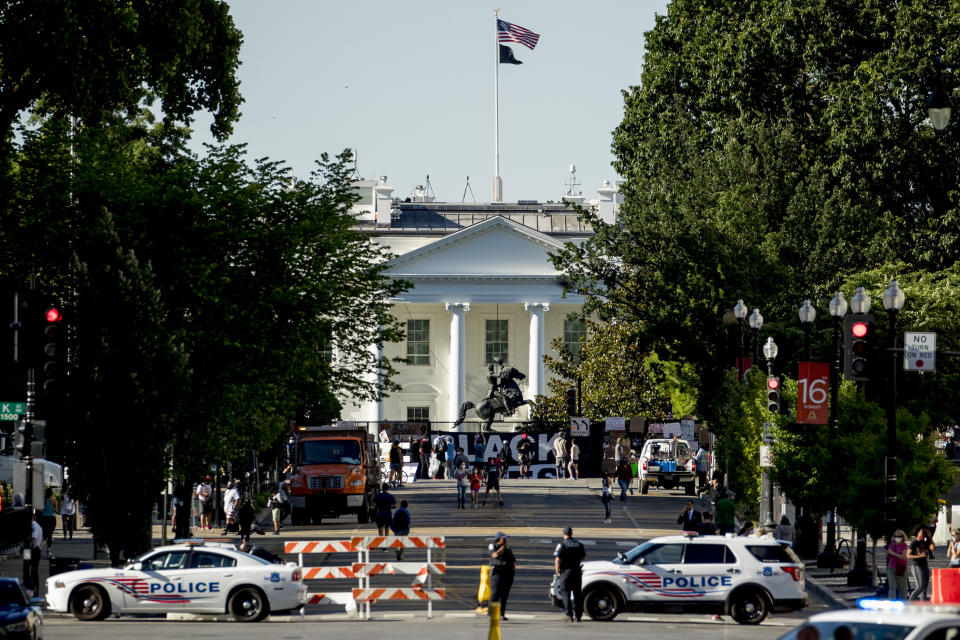 16th Street remains closed to traffic as demonstrators protest, Monday, June 8, 2020, near the White House in Washington, over the death of George Floyd, a black man who was in police custody in Minneapolis. Floyd died after being restrained by Minneapolis police officers. (AP Photo/Andrew Harnik)