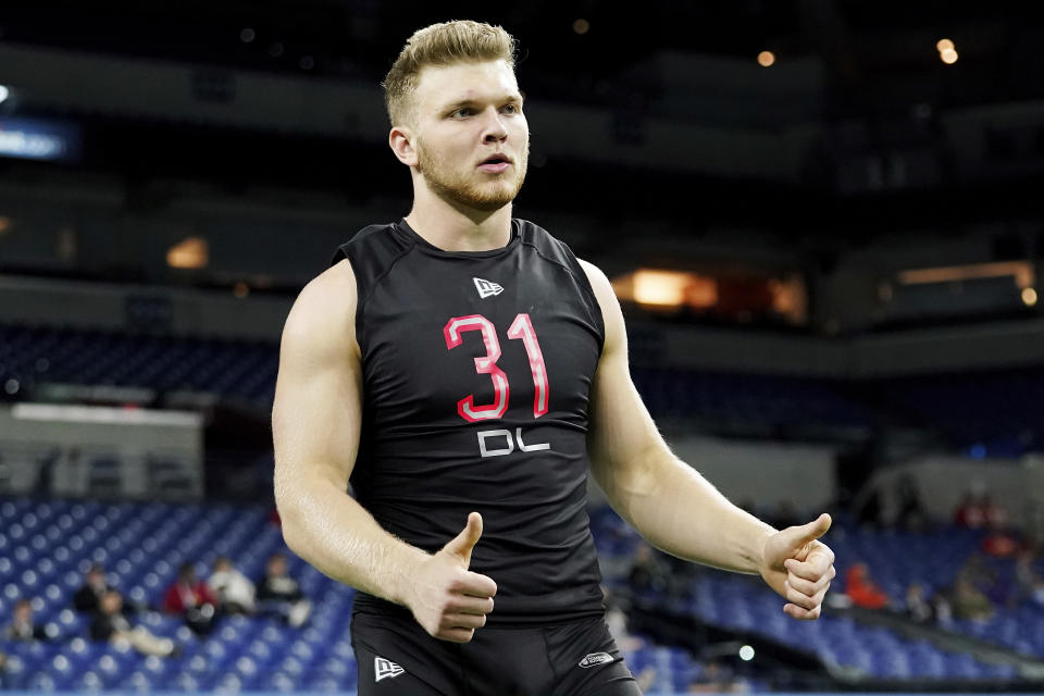 Michigan defensive lineman Aidan Hutchinson projects to be an instant-impact player in the NFL. (AP Photo/Steve Luciano)