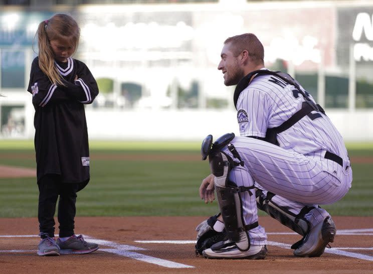 DENVER, CO - SEPTEMBER 17: Tom Murphy #23 of the Colorado Rockies talks to a young girl during activities before the Rockies game against the San Diego Padres at Coors Field on September 17, 2016 in Denver, Colorado. (Photo by Joe Mahoney/Getty Images)