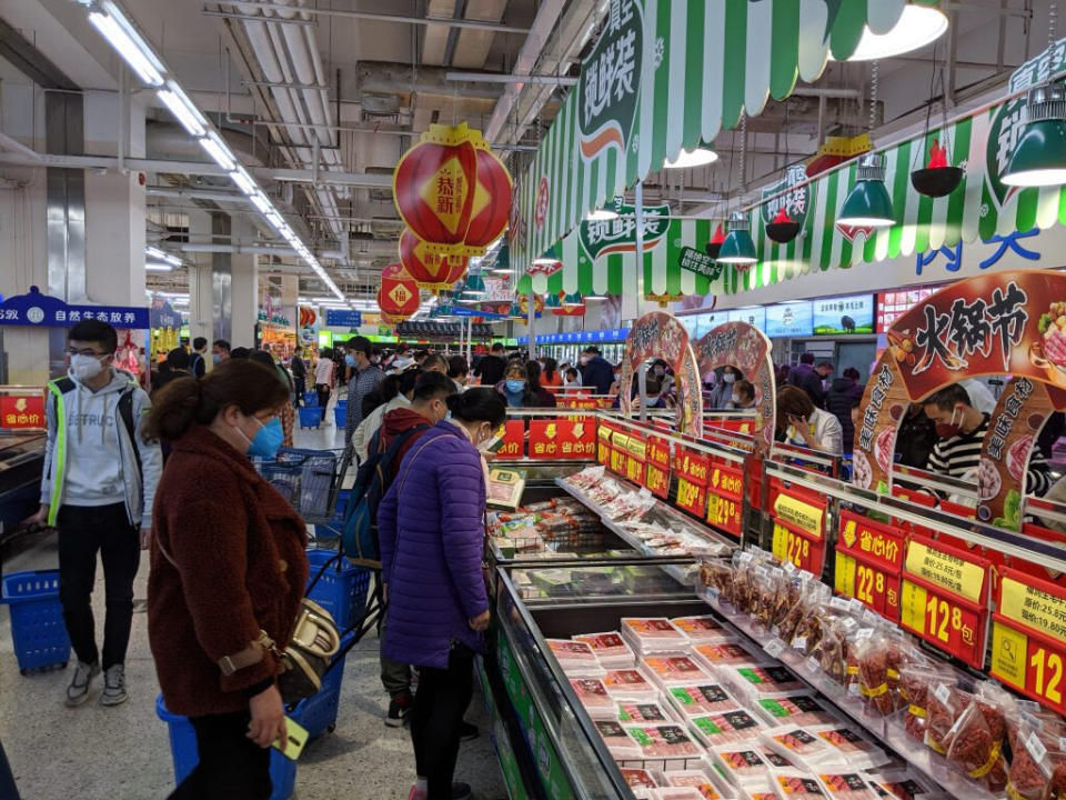 Everybody&rsquo;s wearing masks by the hot pot meats aisle at Shenzhen&rsquo;s Walmart. (Photo: Courtesy of Peter Xu)