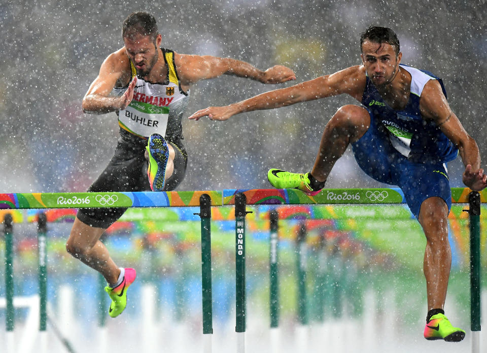 <p>Rain doesn't stop this show. Track athletes competed during rainstorms in Brazil and coincidently enough, several athletes were disqualified because of error. Blame it on the rain? (Photo by Quinn Rooney/Getty Images) </p>