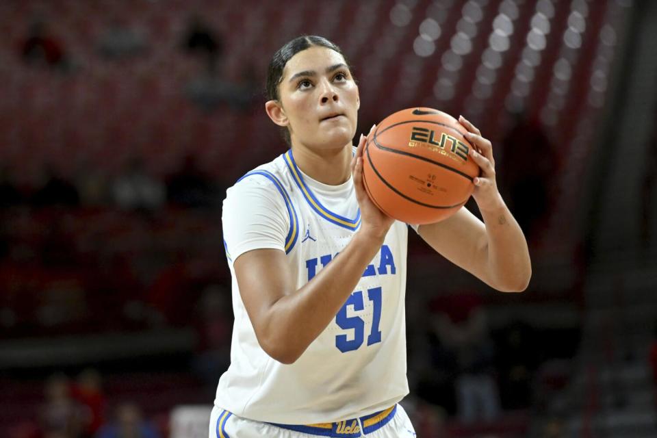 UCLA center Lauren Betts purses her lips as she shoots a free throw against Arkansas