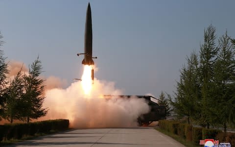 A missile is seen launched during a military drill in North Korea - Credit: Reuters