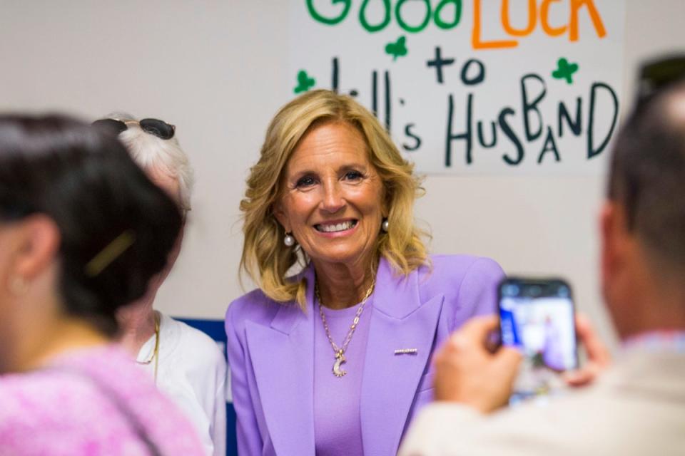 First lady Jill Biden poses for photos with campaign volunteers and supporters at the Virginia Beach Democratic Coordinated Campaign Office on Thursday, June 27, 2024 (AP)