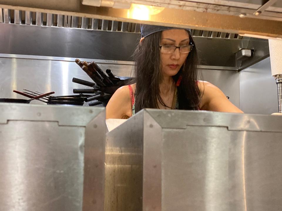 Nisachon "Rung" Morgan works the kitchen May 26, 2022 at Saap restaurant in Randolph.