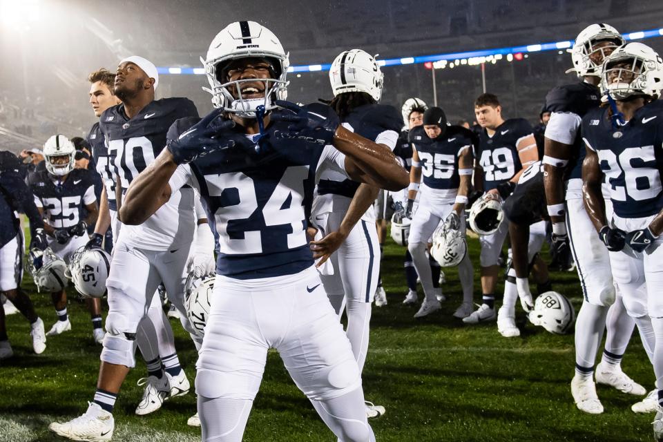 Penn State's freshman running back London Montgomery (24) celebrates following the Nittany Lions' 63-0 win against Massachusetts Saturday, Oct. 14, 2023, in State College, Pa.