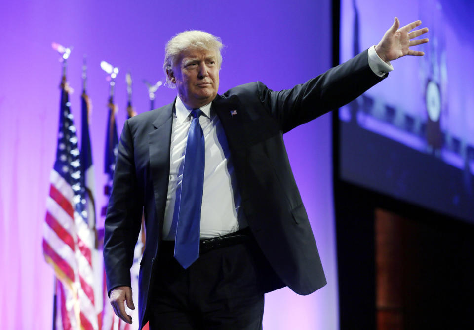 <p>Trump waves as he walks offstage after speaking at the Iowa Republican Party’s Lincoln Dinner, May 16, 2015, in Des Moines. <i>(Photo: Charlie Neibergall/AP)</i> </p>