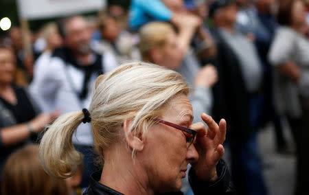 A woman cries during a protest in Sarajevo, Bosnia and Herzegovina May 15, 2018. REUTERS/Dado Ruvic