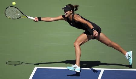 Ana Ivanovic of Serbia hits a return to Karolina Pliskova of the Czech Republic during their match at the 2014 U.S. Open tennis tournament in New York, August 28, 2014. REUTERS/Adam Hunger