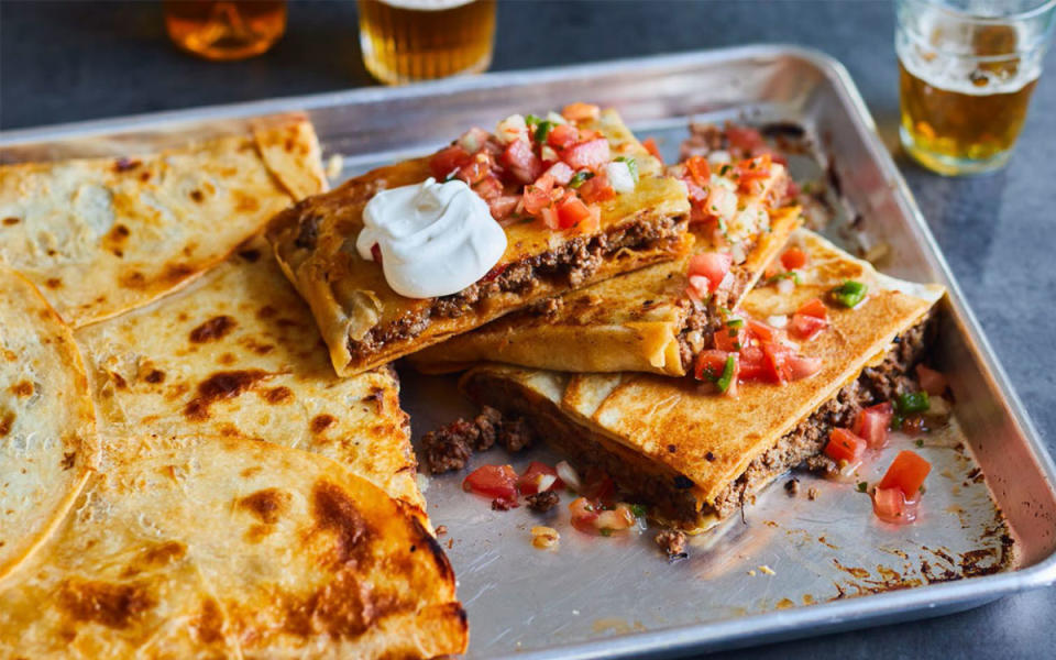 <p>Everyone will devour this sheet pan take on a fast food favorite, the Taco Bell Crunchwrap. Use taco night staples like <a href="https://www.yahoo.com/lifestyle/15-low-carb-ground-beef-145803698.html" data-ylk="slk:ground beef;elm:context_link;itc:0;sec:content-canvas;outcm:mb_qualified_link;_E:mb_qualified_link;ct:story;" class="link  yahoo-link">ground beef</a>, taco seasoning, shredded cheese and tortillas, and add tostadas for a simple, delicious appetizer or snack<em>—</em>no drive-thru necessary.</p><p><strong>Get the recipe: </strong><strong><a href="https://parade.com/1014143/parade/this-crowd-size-taco-is-inspired-by-one-of-taco-bells-most-popular-menu-items/" rel="nofollow noopener" target="_blank" data-ylk="slk:Crowd-Size Taco;elm:context_link;itc:0;sec:content-canvas" class="link ">Crowd-Size Taco</a></strong></p>