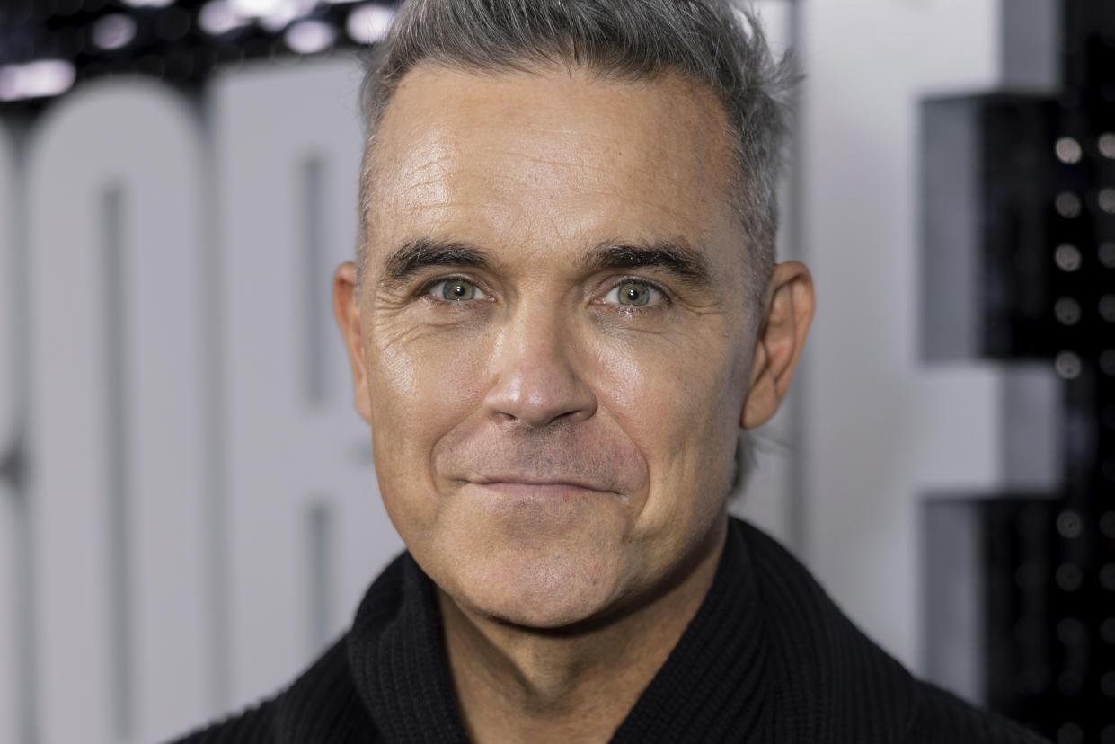 Robbie Williams poses for photographers upon arrival at the premiere for the Robbie Williams documentary on Wednesday, Nov. 1, 2023 in London. (Vianney Le Caer/Invision/AP)