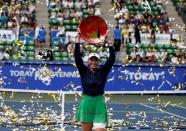 Tennis - Pan Pacific Open Women's Singles Final match - Ariake Coliseum, Tokyo, Japan - 25/09/16. Caroline Wozniacki of Denmark holds the winning plate during an awarding ceremony after winning the final match against Naomi Osaka of Japan. REUTERS/Issei Kato