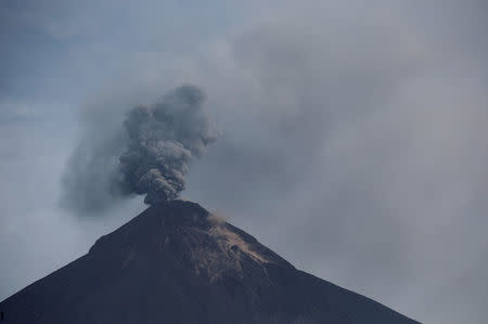 The Fuego volcano spews smoke and ash, as seen from San Miguel Los Lotes in Escuintla, Guatemala June 13, 2018. REUTERS/Luis Echeverria