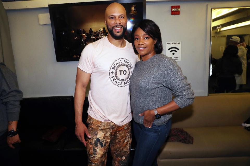 Common and Tiffany Hadish pose together backstage at the Apollo Theater during a stop on his <em>Let Love Tour</em> on Tuesday in N.Y.C. 