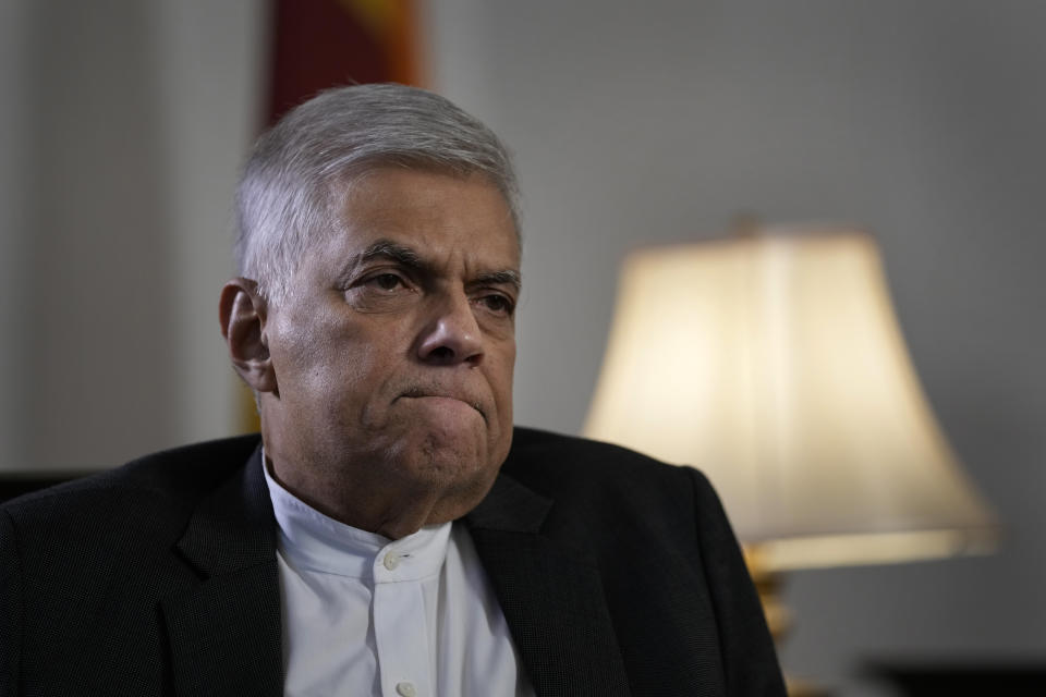 Sri Lanka's new prime minister Ranil Wickremesinghe gestures during an interview with The Associated Press in Colombo, Sri Lanka, Saturday, June 11, 2022. Sri Lanka may be compelled to buy more oil from Russia amid the island nation's unprecedented economic crisis, even as Western nations have largely boycotted Moscow as punishment for its invasion of Ukraine, the newly appointed prime minister said. (AP Photo/Eranga Jayawardena)