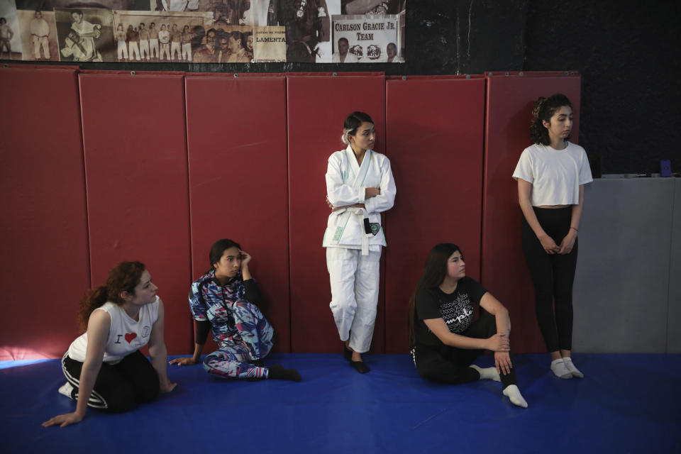 Women take self-defense classes from Dojo Master William H. Hessik, whose adopted daughter Marbella Valdez Villarreal was murdered, at his Carlson Gracie Jiu-jitsu martial arts and gym in Tijuana, Mexico, Sunday, Feb. 23, 2020. When the body of law student Marbella Valdez was found at a garbage dump in Tijuana, the man who was obsessed with her demanded police solve the case, attended her funeral, and a week later was arrested and charged with her murder. The man, identified by Mexican rules only by his first name, Juan, has insisted on his innocence. (AP Photo/Emilio Espejel)