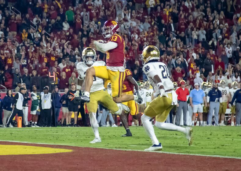 USC Trojans quarterback Caleb Williams scores his third touchdown of the game against Notre Dame.