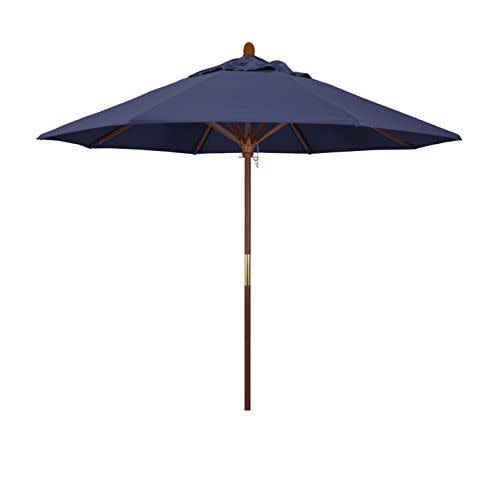 <p><strong>California Umbrella</strong></p><p>amazon.com</p><p><a href="https://www.amazon.com/dp/B0072BDKCU?tag=syn-yahoo-20&ascsubtag=%5Bartid%7C10060.g.39893601%5Bsrc%7Cyahoo-us" rel="nofollow noopener" target="_blank" data-ylk="slk:Shop Now;elm:context_link;itc:0;sec:content-canvas" class="link ">Shop Now</a></p><p><del>$240.00</del> <strong>$182.13 (save 24%)</strong></p><p><strong>Key Specs</strong></p><ul><li><strong>Canopy Size</strong>: 9 feet </li><li><strong>Options</strong>: 1 size; 22 colors</li><li><strong>Weighted Base</strong>: No</li></ul><p>If you’re looking for a wooden frame umbrella to upgrade your patio set, but don't want to spend more than $200, this is by far your best bet.</p><p>The umbrella's frame and ribs are constructed from sustainable hardwoods, featuring a solution-dyed canvas canopy that's waterproof, fade-resistant, and helps block the sun's harmful UV rays. It opens with a crank lift though there's no push-button tilt, which may be a dealbreaker for some. </p><p>We wish you luck in deciding on a color, with an unbelievable 22 options — a mix of vibrant hues, cool neutrals, and two eye-catching striped designs. To ensure the umbrella is stable, it must be secured with a weighted base, which can be purchased separately. </p>