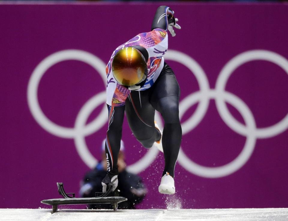 John Daly of the United States starts his second run during the men's skeleton competition at the 2014 Winter Olympics, Friday, Feb. 14, 2014, in Krasnaya Polyana, Russia. (AP Photo/Natacha Pisarenko)