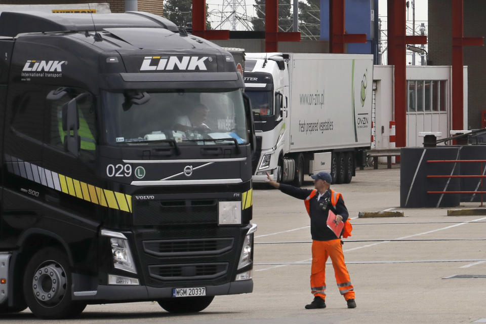 Trucks make their way onto a ferry in Hook of Holland terminal in the harbor of Rotterdam, Netherlands, Tuesday, Sept. 11, 2018. Gert Mulder of the Dutch Fresh Produce Center that supports some 350 traders and growers associations fears the worst if Brexit negotiators fail. One truck driver showing up at the docks without the proper paperwork "could throw it all into chaos," he says. (AP Photo/Peter Dejong)