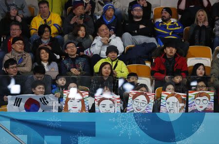Curling - Pyeongchang 2018 Winter Olympics - Women's Final - Sweden v South Korea - Gangneung Curling Center - Gangneung, South Korea - February 25, 2018 - Fans of South Korea watch the match. REUTERS/Phil Noble